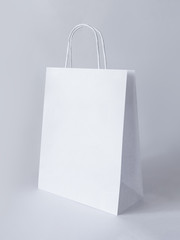Paper bag on light background. Mockup for design