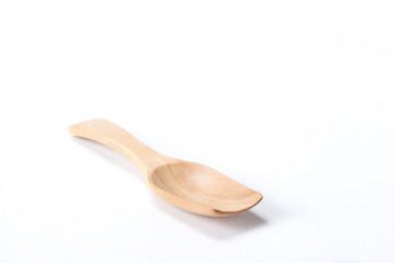 Close up Wood spoon isolated on white background shoot in the studio with space for copy.