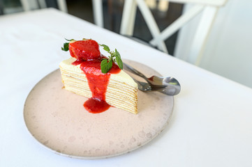 Strawberry crepe cake with strawberry sauce