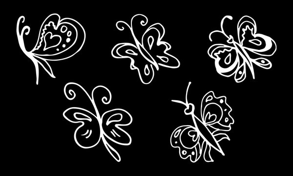 Set of hand drawn butterflies isolated on black background.  doodled elements for decoration