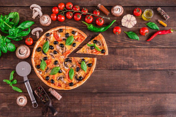 Tasty fresh hot pizza against a dark background. Pizza, food, vegetable, mushrooms