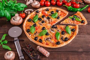 Tasty fresh hot pizza against a dark background. Pizza, food, vegetable, mushrooms