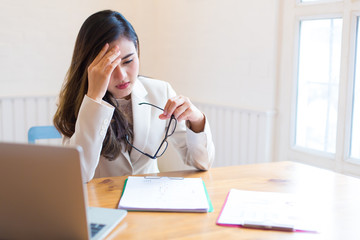 Stressed business woman in the office ,Computer Vision Syndrome concept