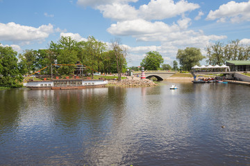 City Jelgava, Latvian Republic. River Lielupe, peoples and urban city view. Houses and walking paths. Jun 9. 2019.