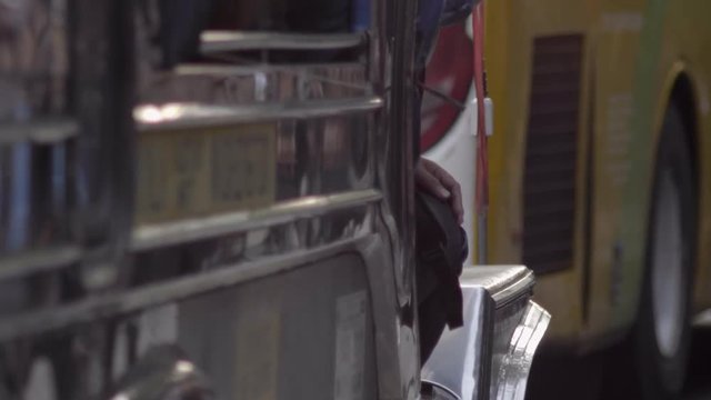 Abstract close up shop of Manila Jeepney taxi in busy traffic