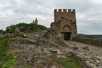 Fototapeta na wymiar Entrance gate of Tsarevets Fortress and Patriarch Church on the Tsarevets hill in Veliko Tarnovo, Bulgaria
