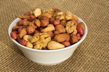 Peeled nuts in a bowl on burlap