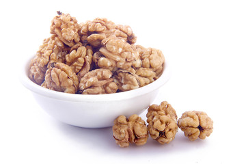 walnut in white bowl on white background