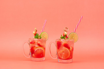 Cold sweet and sour strawberry lemonade juice drinks in the glasses