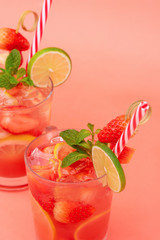 Cold sweet and sour strawberry lemonade juice drinks in the glasses