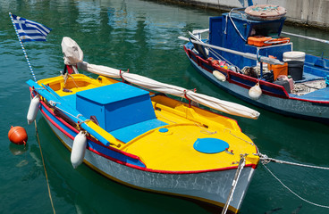 Fototapeta na wymiar Boats in small Aegean sea port in Greece.