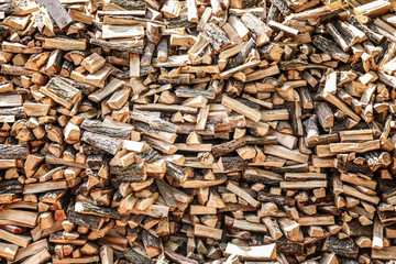 Pile of chopped fire wood prepared for winter outdoors