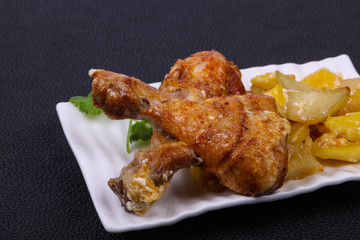 Roasted chicken legs with potato