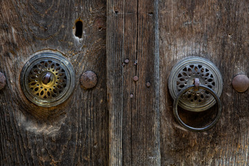 brass door knocker on old wooden door