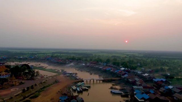 view of r the mekong  river, pan down on fishermen nets. Tonle sap, mekong river. Pile of boats parked on the river.a view during sunset.