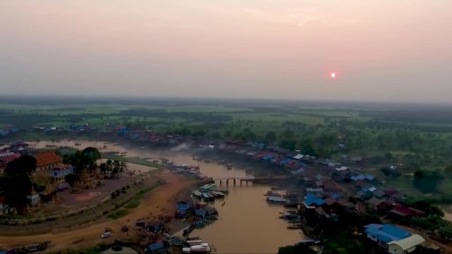 Aerial view  over kampong khleang fishermen village and ancient temple. A beautiful view of sunset with a river and nature in the background