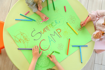 Little children during art lesson in summer camp