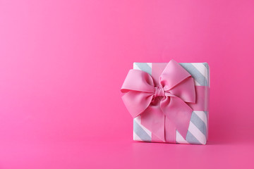 Beautiful gift box on color background
