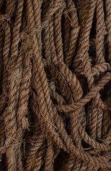 Old, brown ropes used for fishing nets.