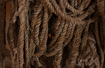 Old, brown ropes used for fishing nets.