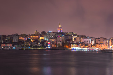 Istanbul cityscape at night, scenic view of city in lights with Galata tower and Golden Horn bay, Bosphorus, Turkey. Outdoor travel background