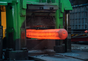 Hot forgings are being processed