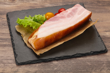 Smoked pork breast with salad leaves