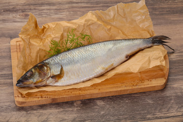 Salted herring over the wooden board