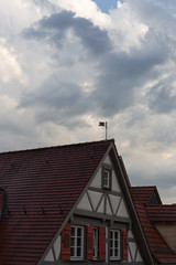 storm clouds over rooftops