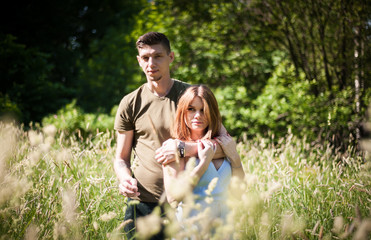 Young Couple Walking In The Park