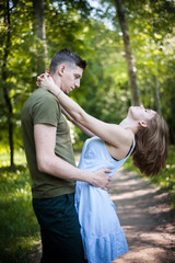 Young Couple Walking In The Park