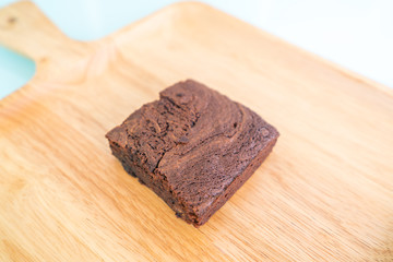 Chocolate brownies on wooden surface