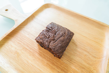 Chocolate brownies on wooden surface