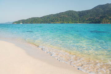 Fototapeta na wymiar Summer concept ,Soft wave lapped the sandy beach Koh Lipe Beach Thailand ,Summer vacation