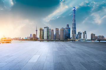 Obraz premium Shanghai skyline and modern city skyscrapers with empty floor at sunset,China