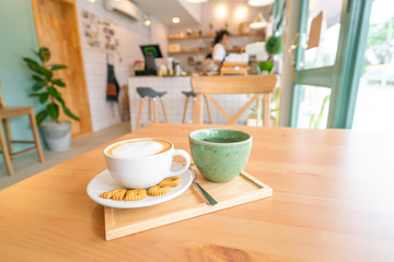 Hot coffee on wooden table