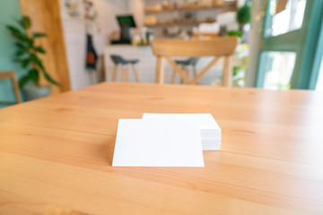 Blank business cards on wooden surface