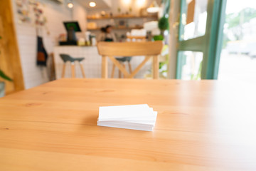 Blank business cards on wooden surface