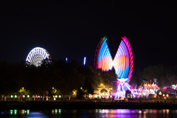 Colourful amusement park night reflection