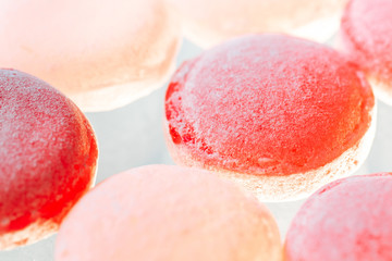 Sweet lollipops sprinkled on a white background
