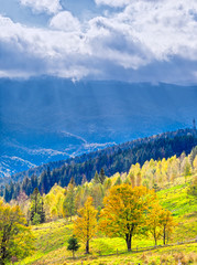 Sun rays over the carpathian autumn mountains