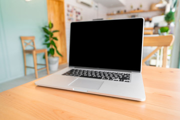 Laptop on wooden table with clipping path