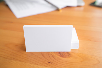 Obraz premium Blank business cards on wooden surface