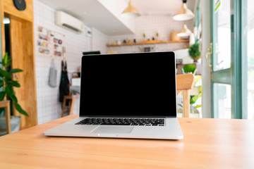 Laptop on wooden table with clipping path