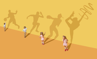 Fototapeta na wymiar Childhood and dream concept. Conceptual image with children and shadow on the yellow studio wall. Little girl and boy want to become gymnast, dancer, artist, boxer, runner or football player.