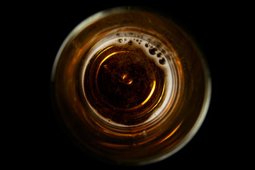 The Bottom Of The  Glass Beer Mug On A Black Background