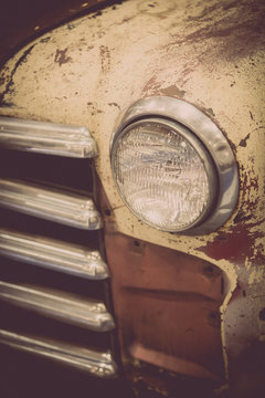Old rusty truck headlight