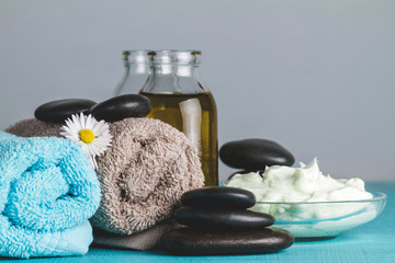 Spa composition with flower on rolled towels