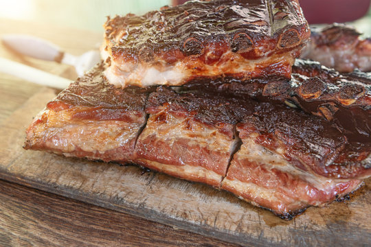 Grilled pork ribs on wooden cutting board
