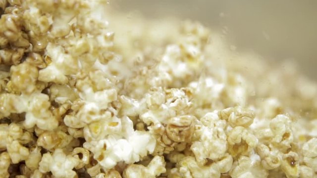 Popcorn with caramel inside a pot. The image is in closeup and with the background in blurred background.
